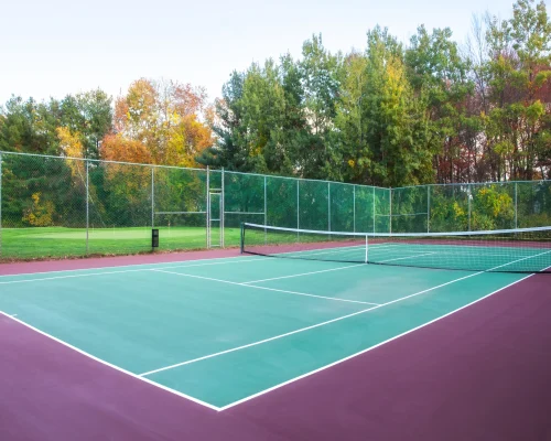 Cross-section of multi-layer tennis court flooring